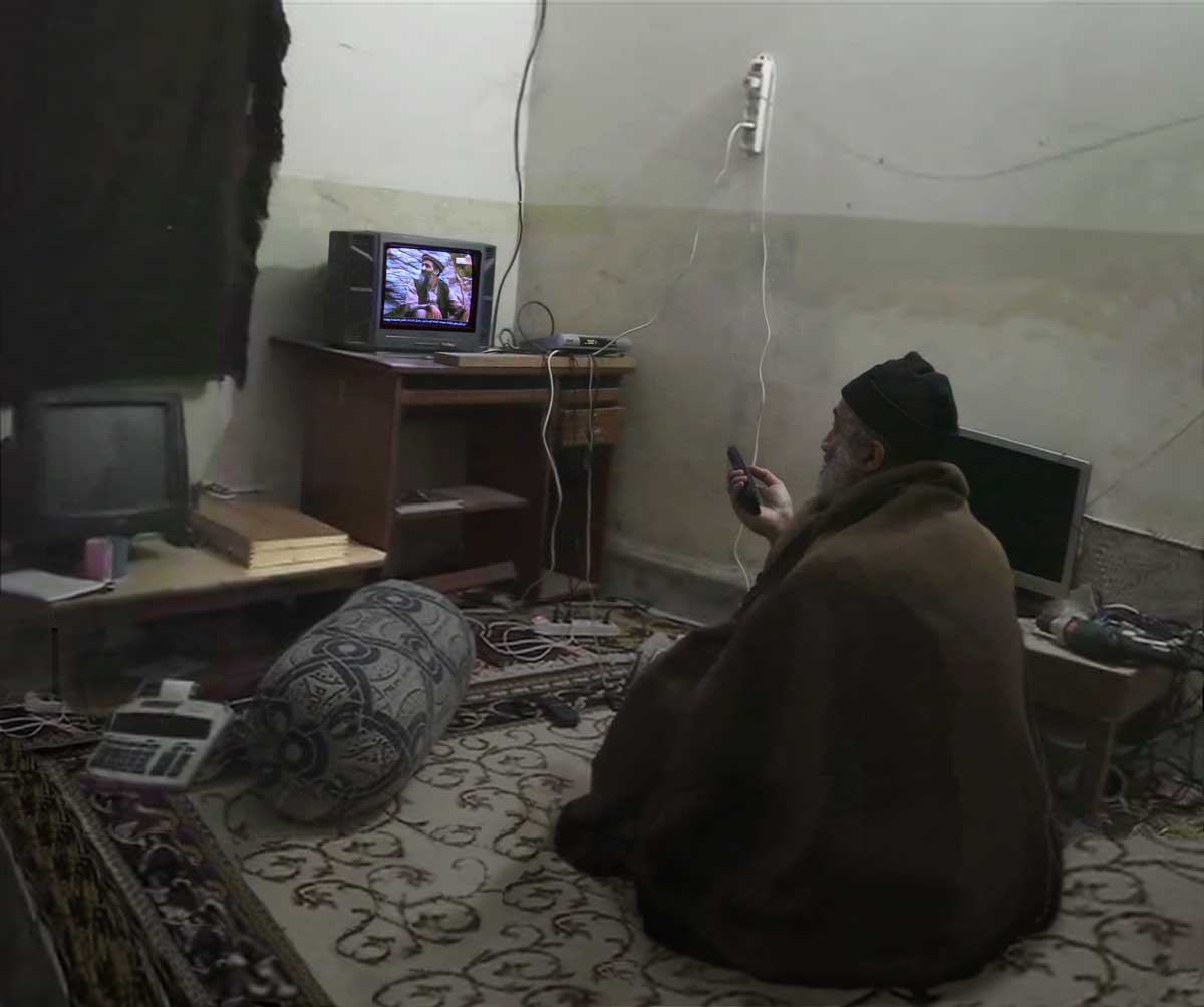 bin Laden watching himself on TV