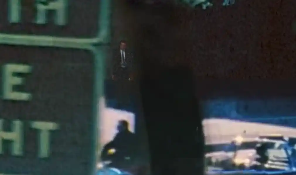 John F. Kennedy JFK assassination, witnesses watch from the triple underpass