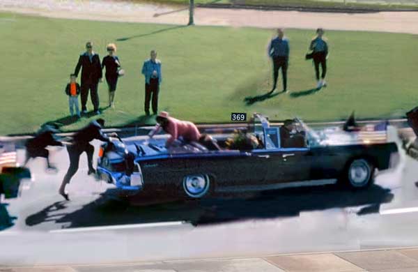 John F. Kennedy JFK assassination Mrs. Kennedy scrambles onto the trunk of the limousine.